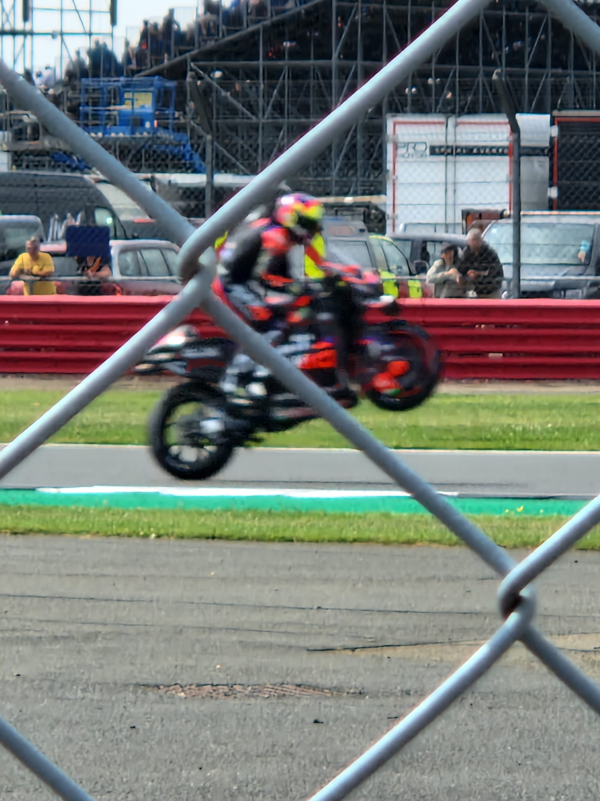 A MotoGP rider wheelies.